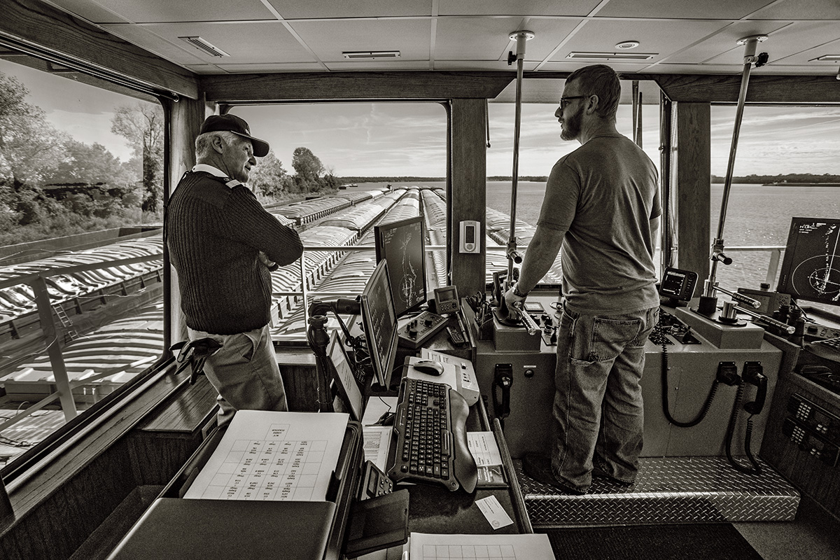 Senior River Chaplain Kempton Baldridge (left) with Capt. Jonathan Butler in the pilothouse of the &lt;i&gt;MV Loree Eckstein&lt;/i&gt;.